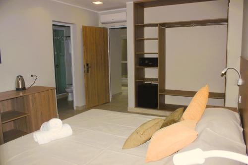 Ένα ή περισσότερα κρεβάτια σε δωμάτιο στο Terra Alta Suites