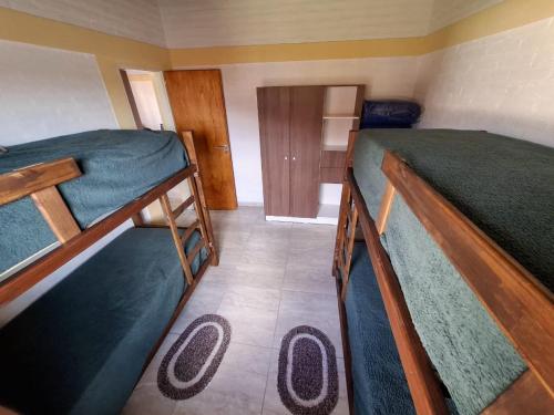 a small room with two bunk beds in it at Cabañas, La Punta Vista Serena in La Punta