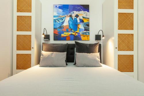 Ένα ή περισσότερα κρεβάτια σε δωμάτιο στο Casa Souira Olhão by Enjoy your stay