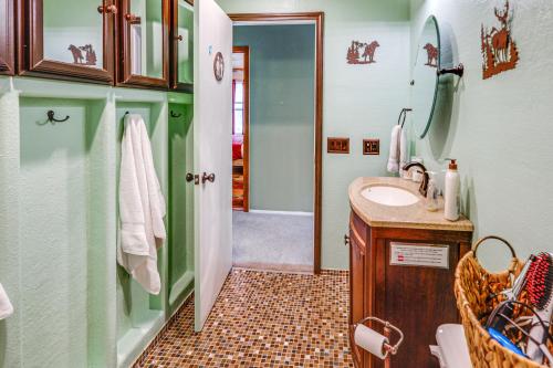 a bathroom with a sink and a mirror at Family Retreat 2 Mi to Santas House Pets Welcome in North Pole