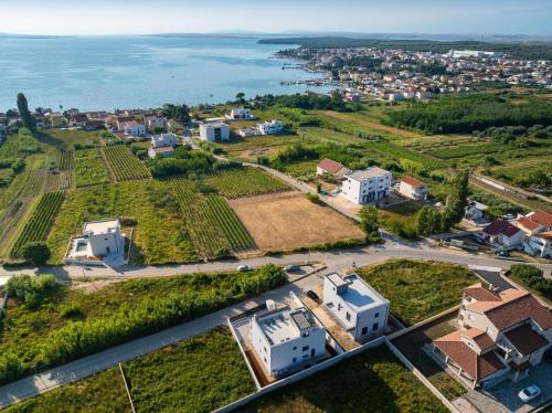 an aerial view of a villa with the ocean at MY DALMATIA - Beach Apartment LaMag in Vrsi