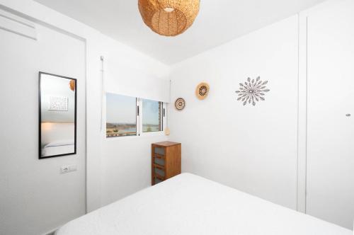 En eller flere senge i et værelse på Apartamento en 1a Línea de playa Beachfront apartment