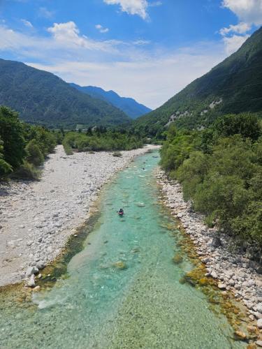a view of a river with mountains in the background at Apartma Zora in Bovec