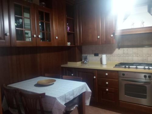 a kitchen with a table with a plate on it at Casa Vacanze in collina - Marina di Camerota in Lentiscosa
