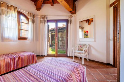 Ένα ή περισσότερα κρεβάτια σε δωμάτιο στο Villa Silènis