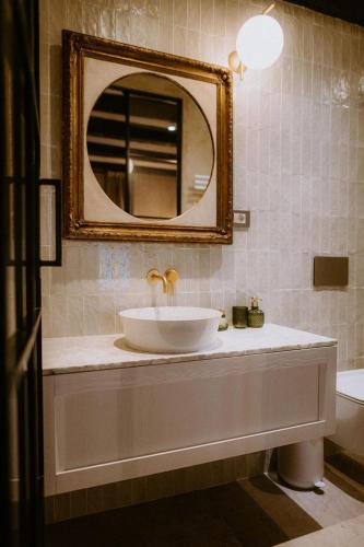 a bathroom with a sink and a mirror at Casa Ars Natura II in Grožnjan