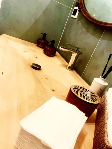 a bathroom with a sink and a mirror on a counter at OAK Glamping Relax in Manziana