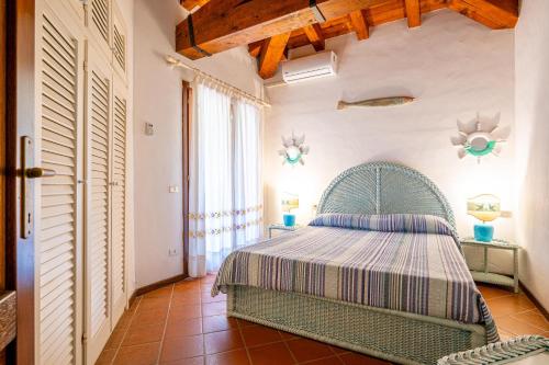 Ένα ή περισσότερα κρεβάτια σε δωμάτιο στο Villa Silènis