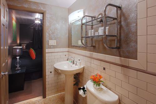 a bathroom with a sink and a toilet at The Roxbury in Roxbury