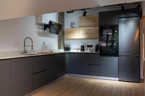 Η κουζίνα ή μικρή κουζίνα στο Apartamentos sarmiento - ático