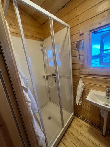 a bathroom with a shower and a sink at Entire cottage at Þingvellir in Selfoss