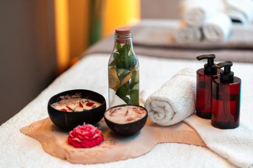 a table with two bowls of food and a bottle at Electra Suites & Spa in Perivolos