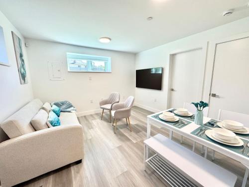 a living room with a couch and a table at Perfect Vancouver Travel Hub for Couples or Family in Vancouver