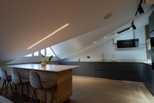 Η κουζίνα ή μικρή κουζίνα στο Apartamentos sarmiento - ático