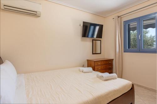 Ένα ή περισσότερα κρεβάτια σε δωμάτιο στο Makis Dream Apartments - Artemis