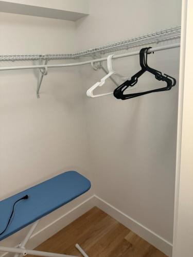 a shelf in a room with a blue bench at One bedroom Apt in Riverview in Riverview