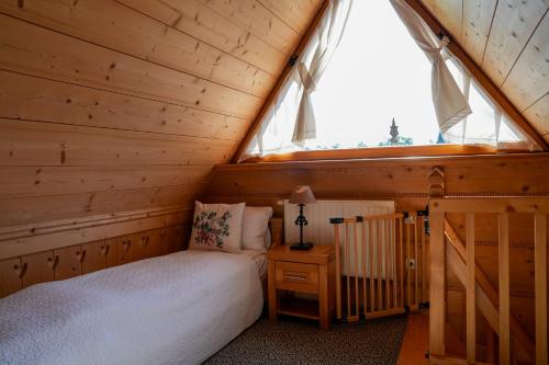 Letto o letti in una camera di Villa Miodula- zwierzęta akceptowane bezpłatnie, bezpośredni widok na góry, parking w cenie! przy pobycie od września do listopada REZERWUJ 4 DOBY W CENIE 3 NOCY dodatkowo 1H JACUZZI GRATIS