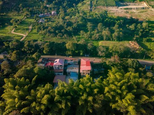 an aerial view of a house in a forest at Hotel Macizo Tiaguanaco in San Agustín