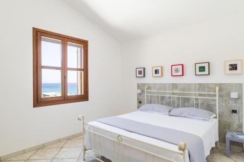 Ένα ή περισσότερα κρεβάτια σε δωμάτιο στο Alisei Villa vista mare