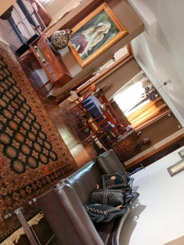 an overhead view of a living room with a leather couch at Rural hοuse in Kastrítsa