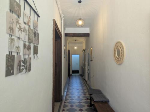 a hallway with a tile floor and a hallway with a hallwayngth at Maison de caractère au calme - FR-1-611-118 