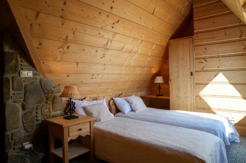 Letto o letti in una camera di Villa Miodula- zwierzęta akceptowane bezpłatnie, bezpośredni widok na góry, parking w cenie! przy pobycie od września do listopada REZERWUJ 4 DOBY W CENIE 3 NOCY dodatkowo 1H JACUZZI GRATIS