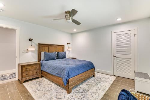 a bedroom with a bed and a ceiling fan at Fish and Swim Home with Catskill Creek Views! in East Durham