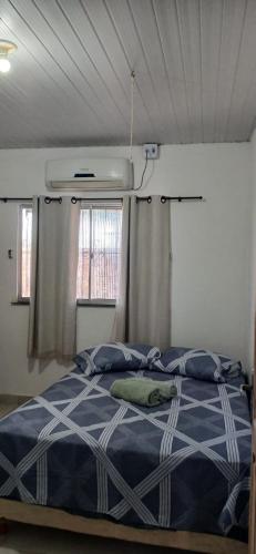 Ένα ή περισσότερα κρεβάτια σε δωμάτιο στο Aguiar beach house