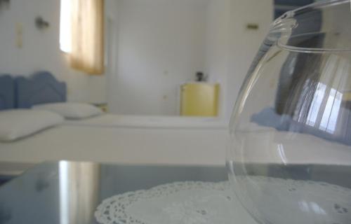 a glass vase sitting on top of a table at Kleanthis Apartments in Rodakino