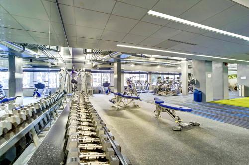 a gym with rows of chairs and machines at Spacius Apt W Excellent Amenities in Arlington
