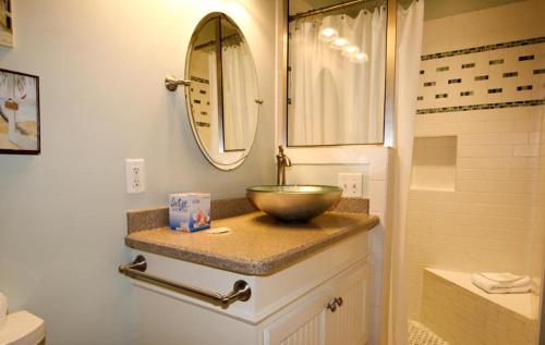 a bathroom with a bowl sink and a shower at 527 Sunsuite in Fripp Island