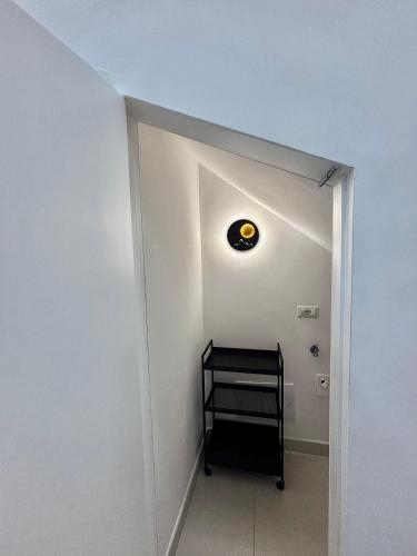 a hallway with a room with a light on the ceiling at Lindas Room in Pozzuoli