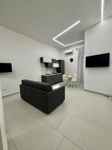 a living room with a couch and a table at Lindas Room in Pozzuoli