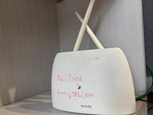 a white object with writing on it in a room at Pomezia centro in Pomezia