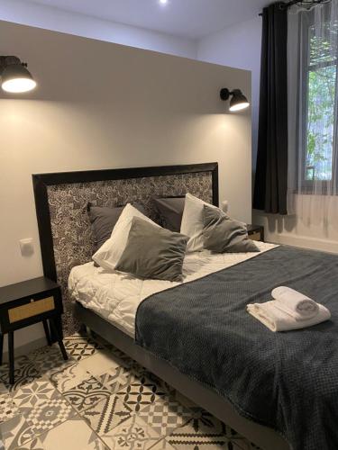 Postel nebo postele na pokoji v ubytování Carcassonne Bastide Appartements
