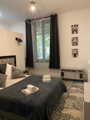 Postel nebo postele na pokoji v ubytování Carcassonne Bastide Appartements