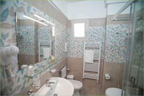 Ein Badezimmer in der Unterkunft Albergo Vittoria