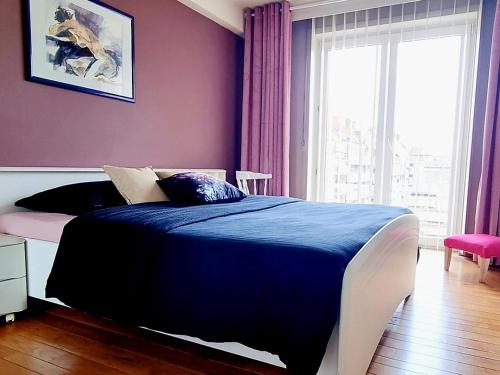 Postel nebo postele na pokoji v ubytování Ruim 4-persoonsappartement
