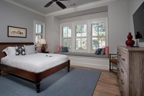 a bedroom with a bed and a window seat at 5 Bedroom Wilson Village Home 5048 in Bluffton