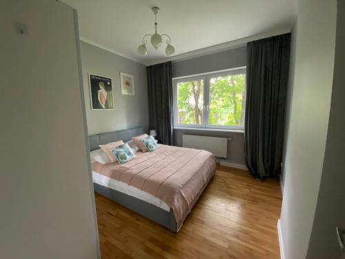 Ένα ή περισσότερα κρεβάτια σε δωμάτιο στο Bajeczne Orłowo