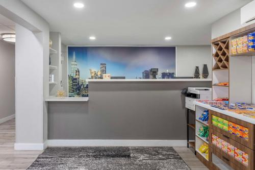 a shop with a large wall mural of a city at Executive Residency by Best Western Philadelphia-Willow Grove in Horsham
