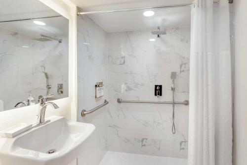 a white bathroom with a sink and a shower at Executive Residency by Best Western Philadelphia-Willow Grove in Horsham