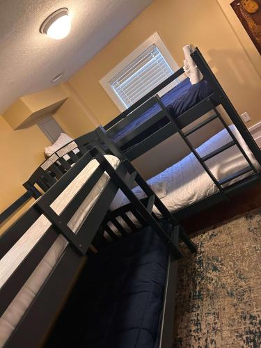 two bunk beds are in a room with a ceiling at Backyard Pool! Refresh at Rivermist Condo in Savannah