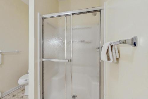 a shower with a glass door in a bathroom at The Oversee in Penn Yan