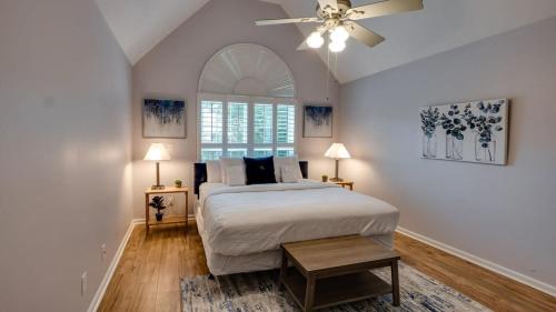 a bedroom with a bed and a ceiling fan at Year-Round Pool & Backyard Near Tybee Island in Savannah