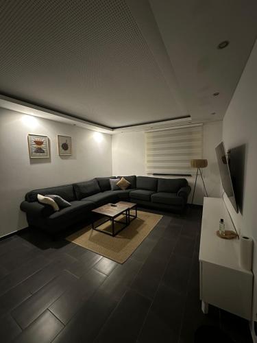 a living room with a couch and a table at Home in Attnang-Puchheim