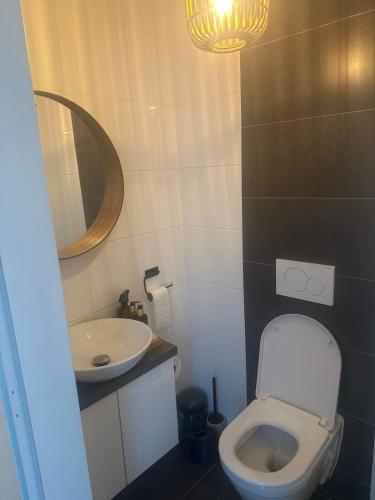 a small bathroom with a toilet and a sink at Home in Attnang-Puchheim