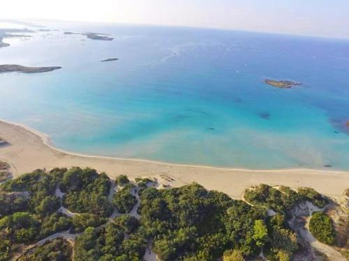 an aerial view of a beach and the ocean at Villetta Maria in Porto Cesareo