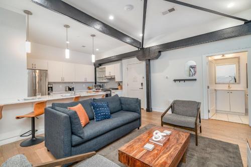 a living room with a couch and a table at The Saddlery-Playlist-2 Units-Walk to Broadway in Nashville