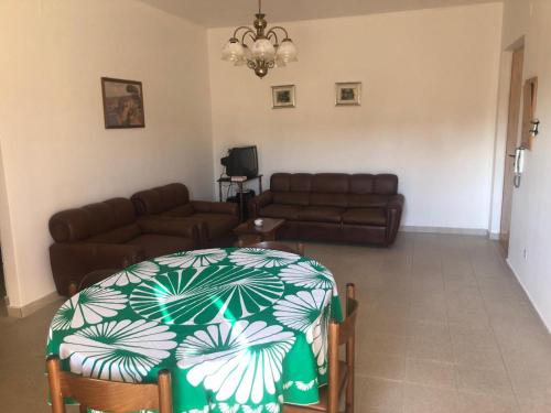 a living room with a couch and a table at Casa Emilia in Ginosa Marina